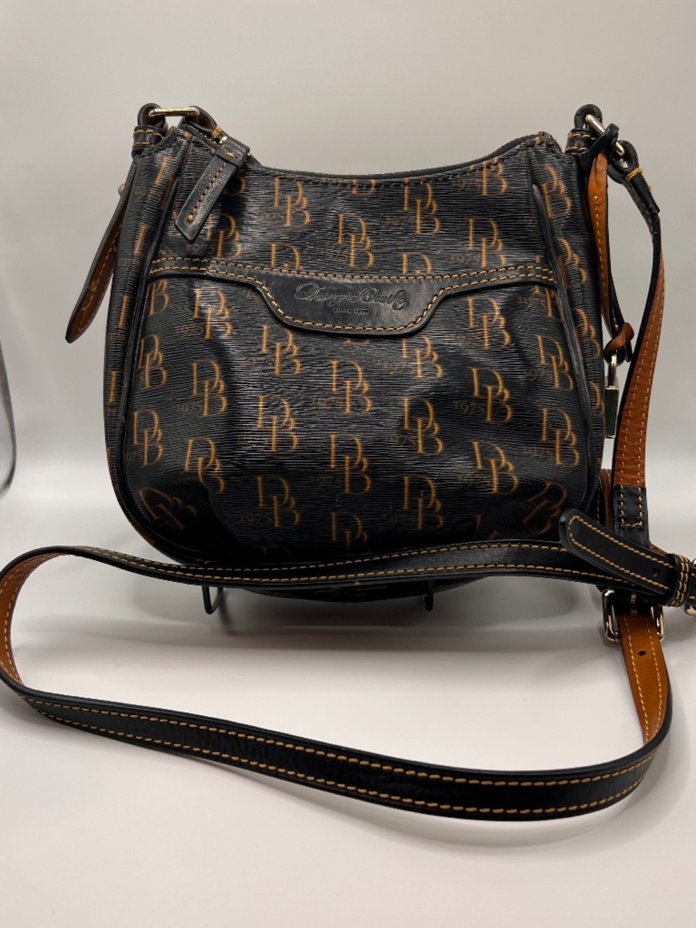 Dooney & Bourke DB Monogram Crossbody Bag. Brown/Tan Red. 1975 Logo. Key Strap.